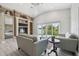 Open living room with lake views, custom built-ins, and vaulted ceilings at 3238 Cullendale Dr, Tampa, FL 33618