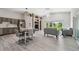 Open-concept living area with vaulted ceiling, modern furnishings, and scenic views through large windows at 3238 Cullendale Dr, Tampa, FL 33618
