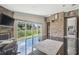 Spacious room features tile floors, a stone accent wall, and sliding glass doors to the backyard at 3238 Cullendale Dr, Tampa, FL 33618