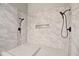 Modern tile shower featuring dual shower heads and pebble-lined accents at 3238 Cullendale Dr, Tampa, FL 33618