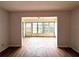 Open living room with tiled floors and sunroom at 3411 Teeside Dr, New Port Richey, FL 34655