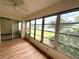 Bright sunroom with tile flooring and exterior view at 3411 Teeside Dr, New Port Richey, FL 34655