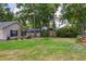 Expansive backyard featuring lush lawn and mature trees for privacy and outdoor enjoyment at 3906 Floyd Rd, Tampa, FL 33618
