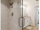 Modern bathroom featuring a glass-enclosed shower and vanity with granite countertop at 3906 Floyd Rd, Tampa, FL 33618