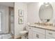 Bathroom with granite countertops, white cabinets and walk-in shower at 3906 Floyd Rd, Tampa, FL 33618
