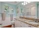 Bright bathroom with double vanity, granite countertop and coordinated accessories at 3906 Floyd Rd, Tampa, FL 33618