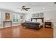 Spacious bedroom features hardwood floors, plantation shutters, and a decorative ceiling fan at 3906 Floyd Rd, Tampa, FL 33618