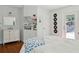 This bedroom has hardwood floors and a door with a window that overlooks the pool at 3906 Floyd Rd, Tampa, FL 33618
