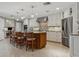 Spacious kitchen with a large central island, stainless steel appliances, and custom cabinetry at 3906 Floyd Rd, Tampa, FL 33618