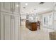Open-concept kitchen with granite countertops, stainless steel appliances, and custom cabinetry at 3906 Floyd Rd, Tampa, FL 33618