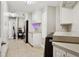 Functional laundry room with washer, dryer, counter space, and built in desk at 3906 Floyd Rd, Tampa, FL 33618