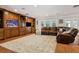 Spacious living room with hardwood floors, custom built-ins, and plenty of natural light at 3906 Floyd Rd, Tampa, FL 33618
