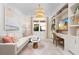 Stylish home office with custom built-ins, plush seating, modern decor, and ample natural light at 3923 Corsica Pl, Wesley Chapel, FL 33543