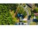 Aerial view showcasing the property boundaries with mature trees and landscaping in a suburban neighborhood at 4012 Woodacre Ln, Tampa, FL 33624