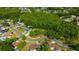 Wide aerial view of a well-situated home surrounded by mature trees and lush landscaping in a desirable neighborhood at 4012 Woodacre Ln, Tampa, FL 33624