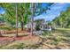 Landscaped backyard featuring a patio and lush greenery, perfect for relaxation at 4012 Woodacre Ln, Tampa, FL 33624