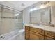 Bathroom featuring a shower, toilet, and vanity with a granite top at 4012 Woodacre Ln, Tampa, FL 33624