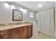 Bathroom featuring granite countertop and shower tub combo at 4012 Woodacre Ln, Tampa, FL 33624