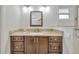 Bathroom featuring dark wood vanity with granite countertop and modern fixtures at 4012 Woodacre Ln, Tampa, FL 33624
