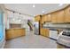 Bright kitchen features stainless appliances, tile flooring, and an open layout, perfect for entertaining at 4012 Woodacre Ln, Tampa, FL 33624