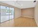 Bright living room featuring sliding glass doors leading to the sunroom at 4012 Woodacre Ln, Tampa, FL 33624