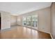 Open-concept living room featuring bright windows, and neutral wall paint at 4012 Woodacre Ln, Tampa, FL 33624