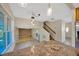 Kitchen and loft area overlooking the living room and staircase, featuring tile flooring at 4012 Woodacre Ln, Tampa, FL 33624