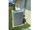View of the outdoor AC unit, in good condition with surrounding green space at 4074 Parkway Blvd, Land O Lakes, FL 34639