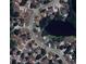 Aerial view of the property location within a neighborhood with nearby streets and a pond at 4074 Parkway Blvd, Land O Lakes, FL 34639