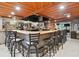 Stylish bar area with bar stools and a full-service setup for entertaining guests at 4074 Parkway Blvd, Land O Lakes, FL 34639