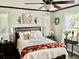 Cozy bedroom with hardwood floors, decorative accents, and natural light at 4074 Parkway Blvd, Land O Lakes, FL 34639