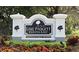 Lake Padgett Estates East community sign with lush landscaping and manicured flowerbeds at 4074 Parkway Blvd, Land O Lakes, FL 34639
