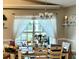 Dining room featuring a large window with sheer curtains and a view of the backyard at 4074 Parkway Blvd, Land O Lakes, FL 34639