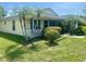 Charming single-story home featuring well-kept lawn, quaint porch, and appealing curb appeal at 4074 Parkway Blvd, Land O Lakes, FL 34639