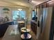 Charming kitchen with stainless steel appliances, kitchen island, and eat-in breakfast nook at 4074 Parkway Blvd, Land O Lakes, FL 34639