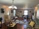 Spacious living room featuring a mix of vintage and contemporary furniture, plus lots of light at 4074 Parkway Blvd, Land O Lakes, FL 34639