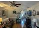 Inviting living room with ceiling fan, wood-look flooring, and comfortable seating arrangement at 4074 Parkway Blvd, Land O Lakes, FL 34639