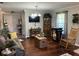 Inviting living room with hardwood floors, vintage decor, and lots of natural light at 4074 Parkway Blvd, Land O Lakes, FL 34639