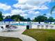 Community pool with lounge chairs and umbrellas perfect for enjoying sunny days at 4074 Parkway Blvd, Land O Lakes, FL 34639