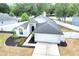 Aerial view of the house showing the front yard and driveway at 4302 Longfellow Dr, Plant City, FL 33566