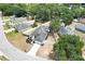 An aerial view of a beautiful suburban home with a well-maintained lawn and in-ground swimming pool at 4302 Longfellow Dr, Plant City, FL 33566