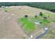 High aerial shot of the community park with fields, trees, and shelters at 4302 Longfellow Dr, Plant City, FL 33566