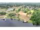 Aerial view showcasing lakefront park with piers, landscaping, and walking paths at 4302 Longfellow Dr, Plant City, FL 33566
