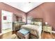 Cozy primary bedroom has wood floors, a ceiling fan, and ensuite bathroom access at 4302 Longfellow Dr, Plant City, FL 33566