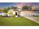 Charming single-Gathering home with a manicured lawn and attached two-car garage at 4302 Longfellow Dr, Plant City, FL 33566