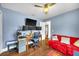 Home office featuring multiple monitors, hardwood floors and comfy couch at 4302 Longfellow Dr, Plant City, FL 33566