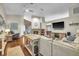 Spacious living room features hardwood floors, a stone fireplace, comfortable seating, and plenty of natural light at 4302 Longfellow Dr, Plant City, FL 33566