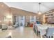 Bright living room showcasing tile floors, high ceilings, and sliding doors to the outdoor pool area at 4302 Longfellow Dr, Plant City, FL 33566