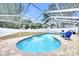 Screened-in pool area with a view of the expansive backyard space at 4302 Longfellow Dr, Plant City, FL 33566