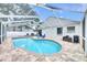 Private backyard screened-in pool area with brick pavers and lounge area at 4302 Longfellow Dr, Plant City, FL 33566